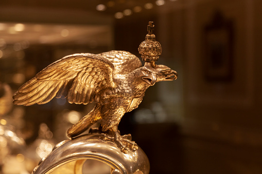 Statuette of a golden double-headed eagle with a crown.