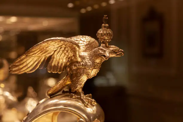 Photo of Statuette of a golden double-headed eagle with a crown