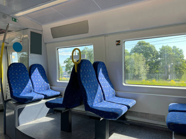 istock Train chairs and view through window. Comfortable chairs on a modern train, with beautiful view through the window. Empty interior of the train for long and short distance in Europe. 1500787846