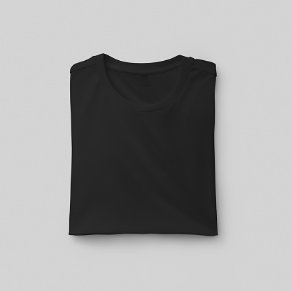 Template of a folded men's black t-shirt with a label, close-up front view, fashion clothes, for design, print. Fashion shirt mockup isolated on background. Photography of a product for commerce