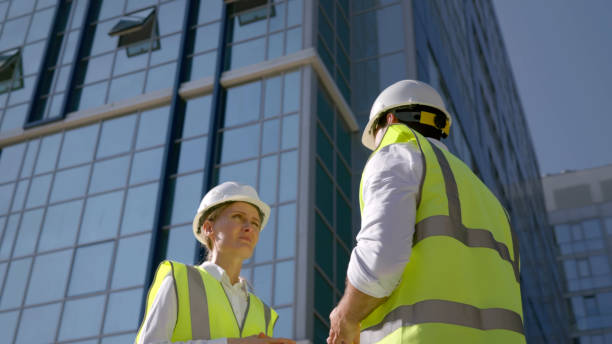 istock Low angle view of civil engineer team in hardhat at construction site 1500792244