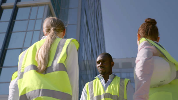 istock Low angle view of industrial architect team discussing outdoors 1500792344