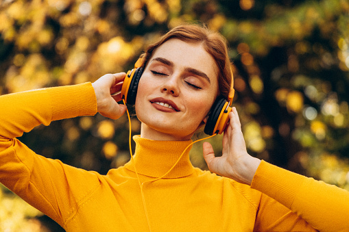 Beautiful woman enjoying autumn