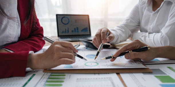istock Asian business people meeting, planning and discussing chart data analysis. financial calculations and business efficiency Accounting concept. Marketing 1500800948