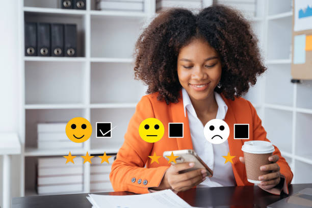 istock User give rating to service experience on online application smartphone. 1500801531