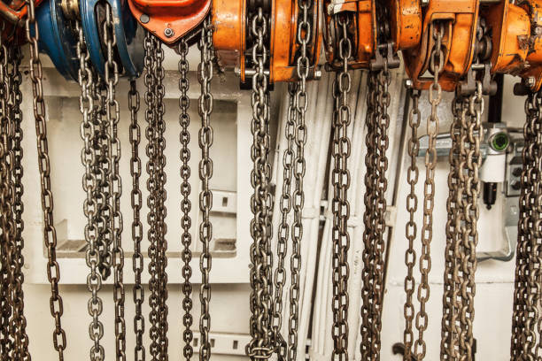 istock Chain hoists for lifting weights in a workshop close-up. 1500803019