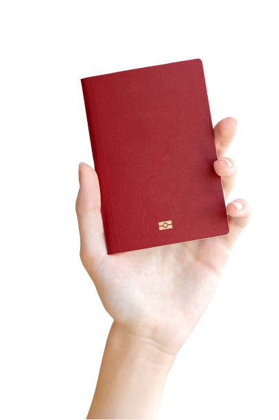 istock A hand holds a passport on a white background. Document, citizenship, residence permit 1500803770
