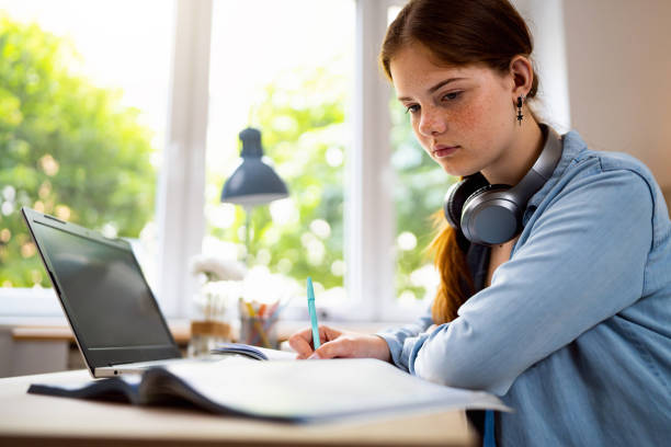 istock Teenage girl doing homework 1500804876