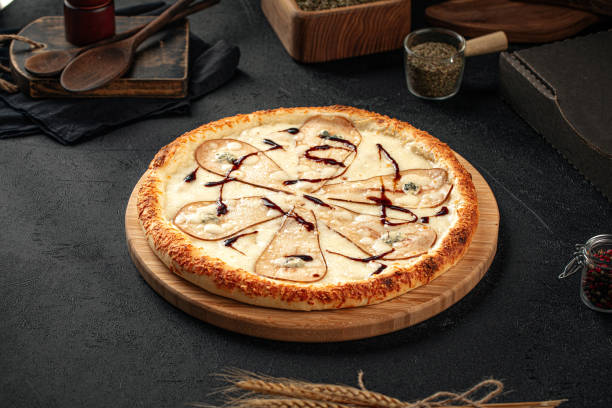 istock Top view on pizza with pear and cheese 1500805624