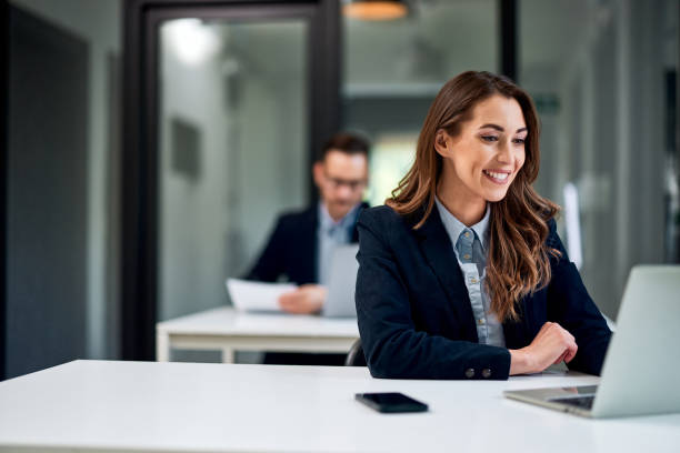 istock A smiling female employee having a video call with a client over a laptop. 1500808098