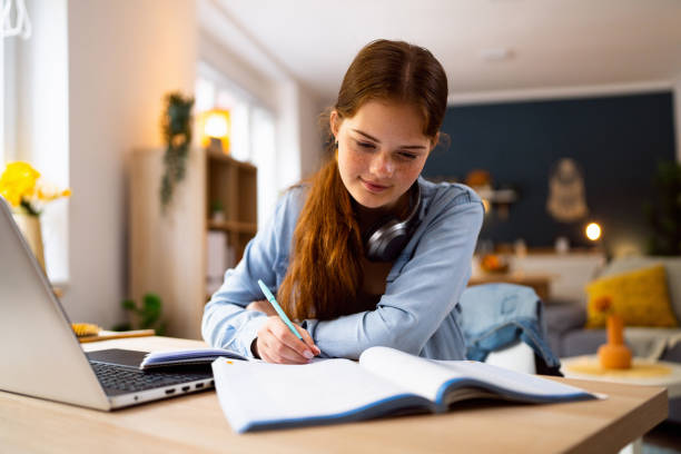 istock Teenage girl doing homework 1500808814