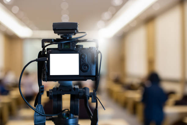 camera with white screen in news broadcast live studio. digital video creativity production media professional.
