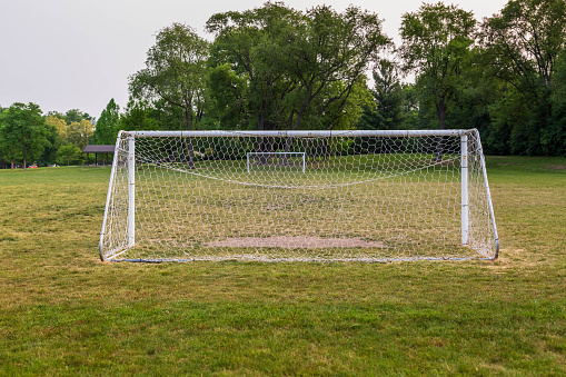 early morning view of a youth soccer field in a city park