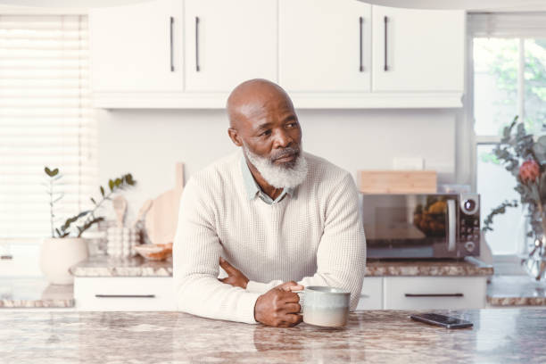 istock Handsome man drinking coffee at home 1500818770
