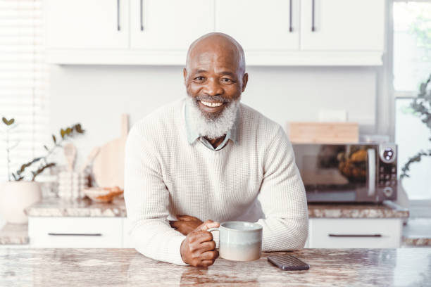 istock Handsome man drinking coffee at home 1500818934