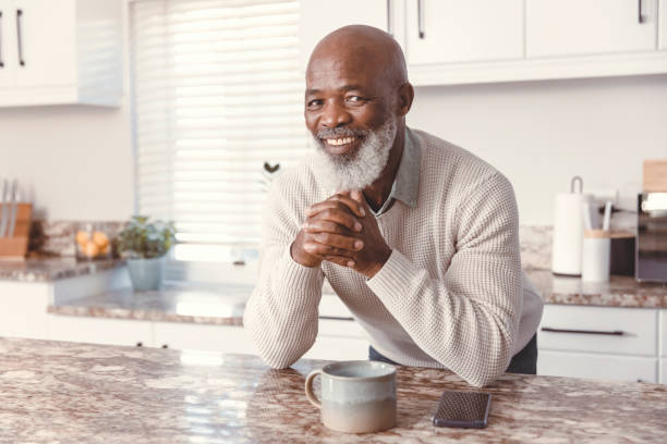 istock Handsome man drinking coffee at home 1500818939