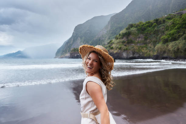 istock Happy woman with a hat having fun on the beach. 1500819230