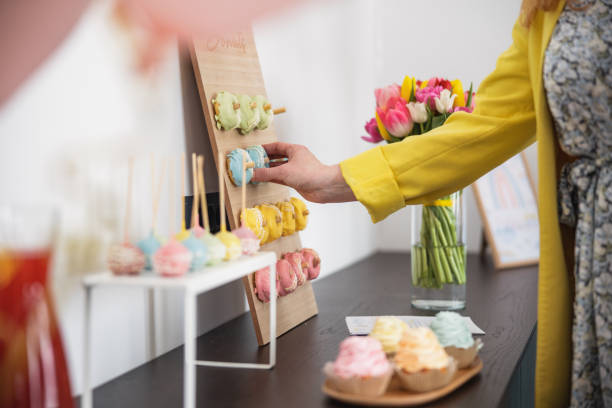 istock Unrecognizable Woman Taking A Doughnut At A Baby Shower Celebration 1500819472