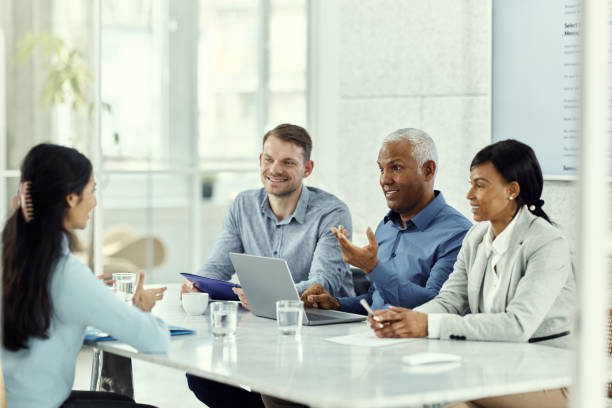 istock Happy human resource team talking to a candidate on a job interview. 1500822688