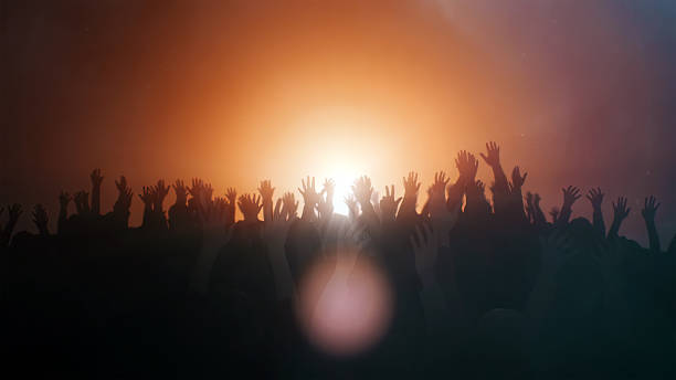 Praying hands background Praying hands with illuminated background evangelic stock pictures, royalty-free photos & images