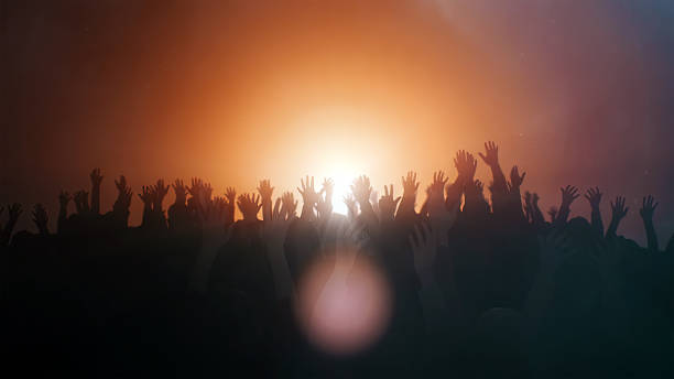 Praying hands background Praying hands with illuminated background pentecost religious celebration photos stock pictures, royalty-free photos & images