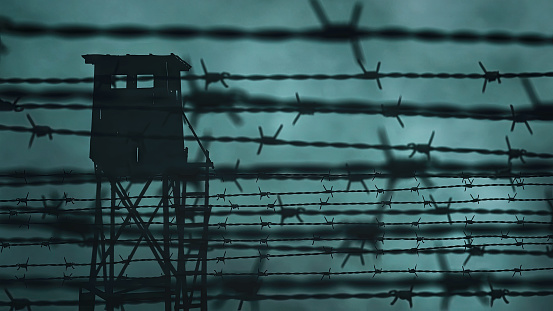 Prison barbed wire and a watchtower. Image generated from real elements and composed in After Effects (CGI).