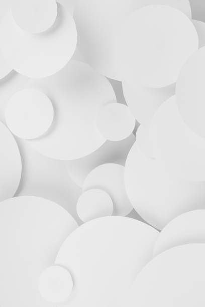 istock White abstract background of soar paper circles pattern of different size, perspective, top view, backdrop for advertising, design, card, poster, flyer, text in elegant soft light minimalistic style. 1500830429