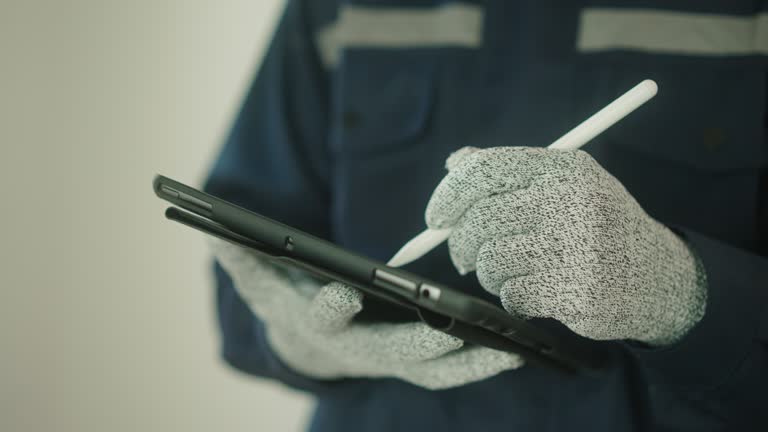 Technician working with digital tablet.