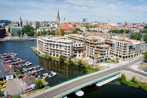 Aerial view of the Odra river with new housing estate under construction, Szczecin, Poland