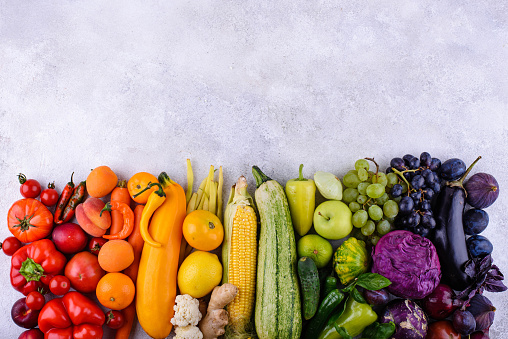 Assortment of red, yellow, green, orange, purple vegetables and fruits. Rainbow food