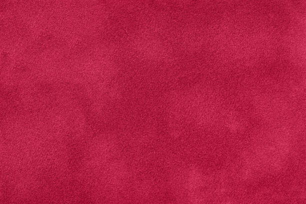 istock Texture of velvet dark red matte background, macro. Suede fabric with wine pattern. 1500845621