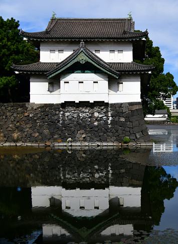 Chiyoda, Tokyo, Japan: korai style Inner Sakurada Tatsumi Turret ('江戸城 桜田巽櫓'), one of the few gates left of the Ninomaru on Edo Castle, reflected on Kikyo-bori moat, Chiyoda ward.