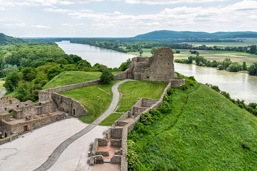 June 21, 2023: Devin, Slovakia - The Hrad Devin in the small Slovakian town of Devin. The photo was taken during a hot summer day and shows the ruins of the castle along with the area around the Danube River which it guards.