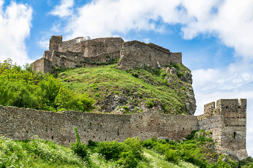 June 21, 2023: Devin, Slovakia - The Hrad Devin in the small Slovakian town of Devin. The photo was taken during a hot summer day and shows the ruins of the castle along with the area around the Danube River which it guards.