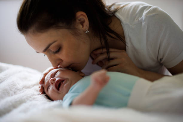 istock Mother and crying newborn baby 1500858045
