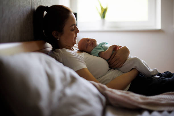 istock Sleeping baby and mother 1500858157