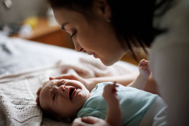 istock Mother and crying newborn baby 1500858356