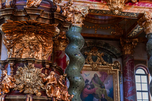 Vienna, austria, may 25, 2023 : pulpit details in the nave of the Jesuit church