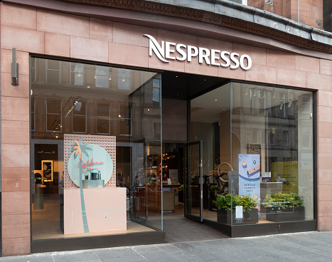 16th June 2023 - Glasgow, Scotland: Entrance and shop front of Nespresso in Buchanan Street, Glasgow. Nespresso is a B corporation, part of the Nestle group headquartered in Lausanne, Switzerland. It produces coffee pods and coffee makers.