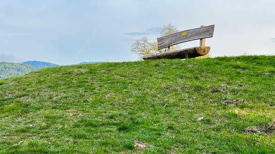 Wooden bench up the hill