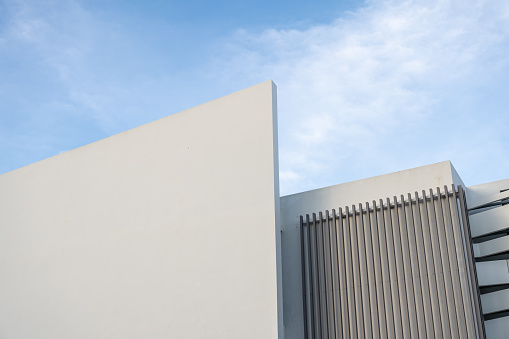 A corner of a simple white geometric building