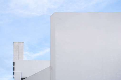 A corner of a simple white geometric building