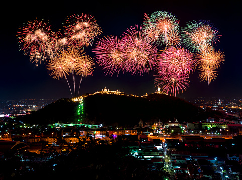 firework festival Pra Nakorn Kiri in Petchaburi Thailand. famous fireworks display over three pagodas on Khao Wang hill at night.