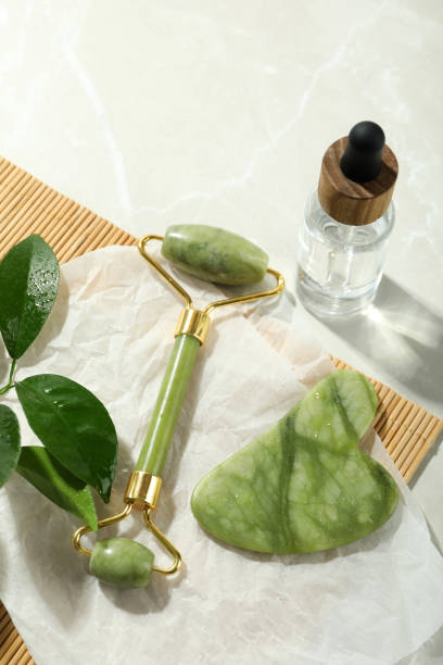 istock Face care concept with gua sha, face roller and cosmetic 1500880229