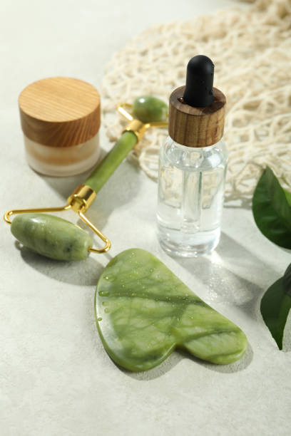 istock Face care concept with gua sha, face roller and cosmetic 1500880294