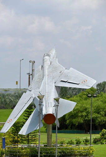 Kolkata / Calcutta, West Bengal, India: Indian Air Force MiG-27 on static display - Mikoyan-Gurevich MiG-27 ('Микоян-Гуревич МиГ-27 ', NATO codename Flogger-D ) is a single-engine, variable geometry wing, fighter aircraft developed in the Soviet Union during the Cold War. It is an advanced fighter-bomber variant of the MiG-23 - From 1986 India built a model called Bahadur / 'Valiant' (modernized MiG-27M) under license. high altitude conflict in Kargil in 1999 - many planes were lost to accidents - Netaji Subhash Chandra Bose International Airport / Kolkata International Airport.