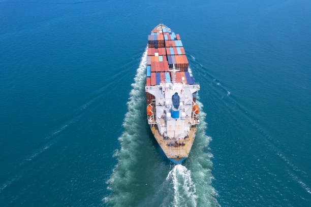 istock Top viewContainer ship loading and unloading in sea port, Aerial view of business logistic import and export freight transportation by container ship in harbor, Container loading Cargo freight ship, Dubai 1500880997