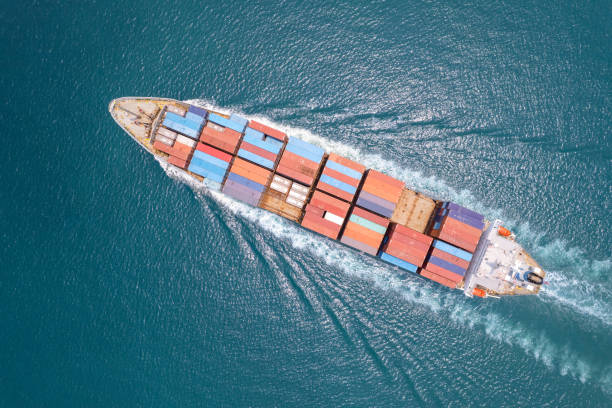istock Top viewContainer ship loading and unloading in sea port, Aerial view of business logistic import and export freight transportation by container ship in harbor, Container loading Cargo freight ship, Dubai 1500881018