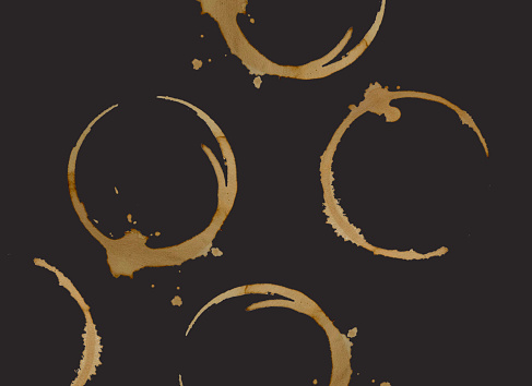 Coffee cup pattern. Coffee stains on black background