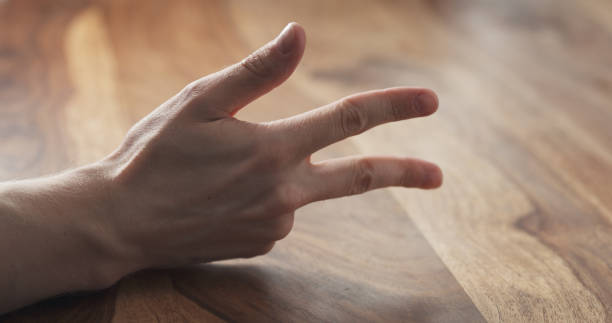 istock Young man hand finger count at the table 1500887049
